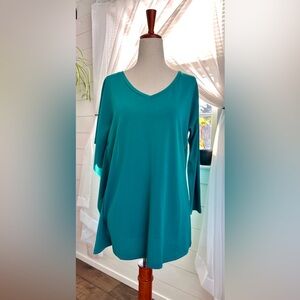 Charming Charlie teal V-neck one sleeve woman’s blouse
Size: Small